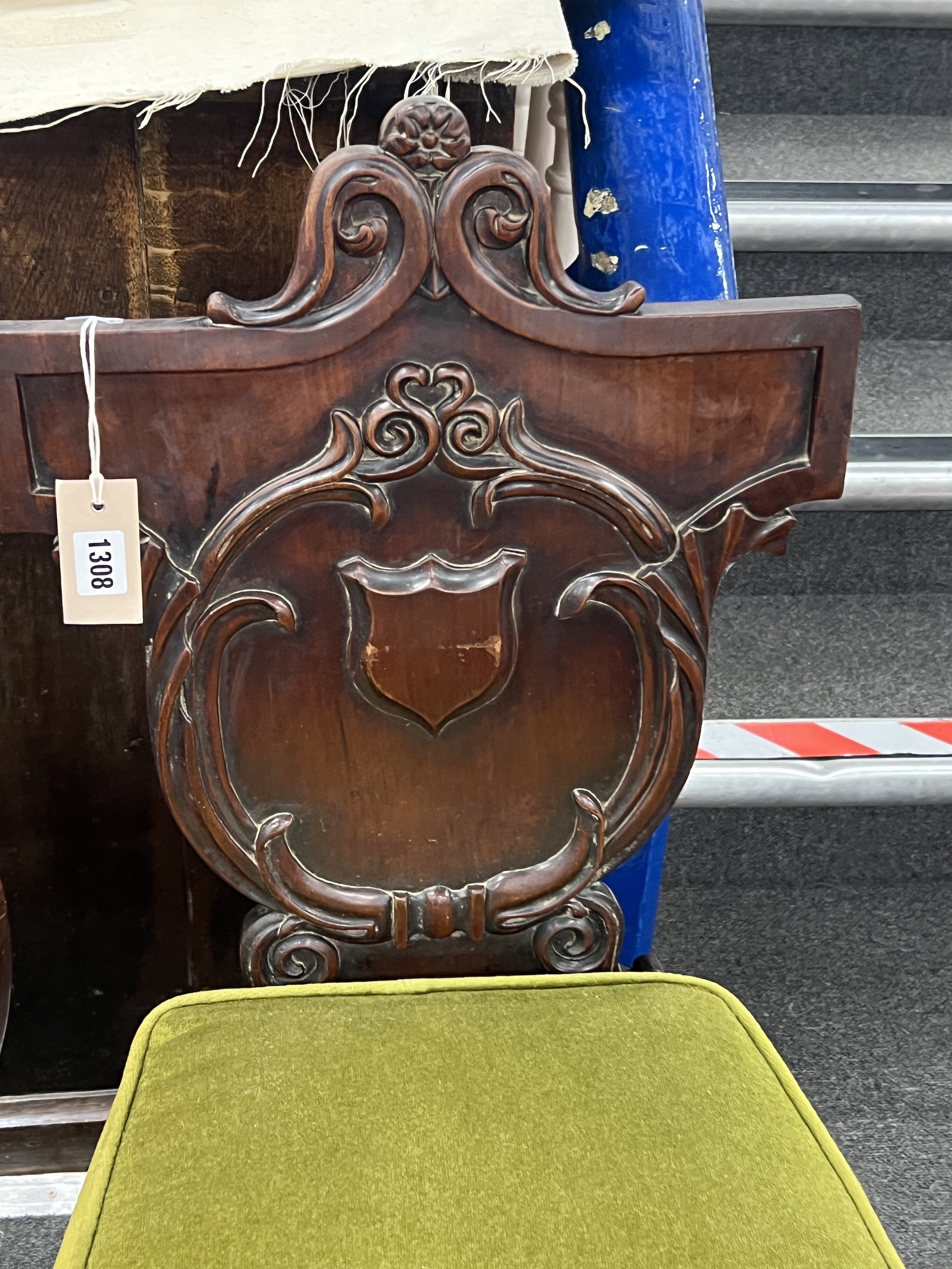 A Victorian carved mahogany hall chair and a Victorian mahogany child's chair